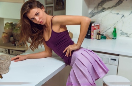 Nice teen Kalisy showcases her bald pussy with a high degree of confidence