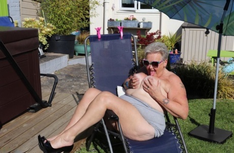 Fat nan Valgasmic Exposed licks a shoe while exposing herself in the backyard