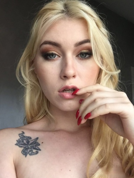 Beautiful blonde slut Misha Cross takes a selfie fully clothed and stark naked