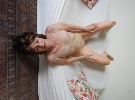 Skinny granny Kat Kitty showcases her vagina while completely naked