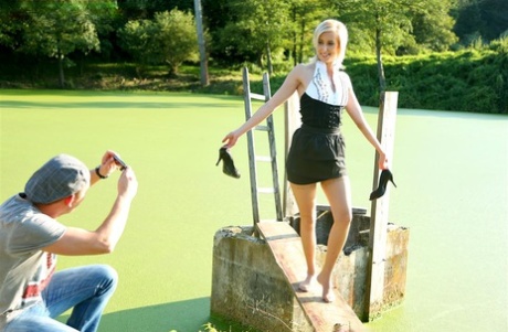 Blonde female captures a stream of pee in her mouth after outdoors sex