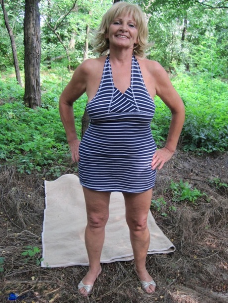 Mature blonde lady Sally G has POV sex on a blanket in the woods