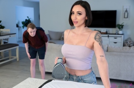 Brunette MILF Blaire Johnson bangs her stepson on top of her bed