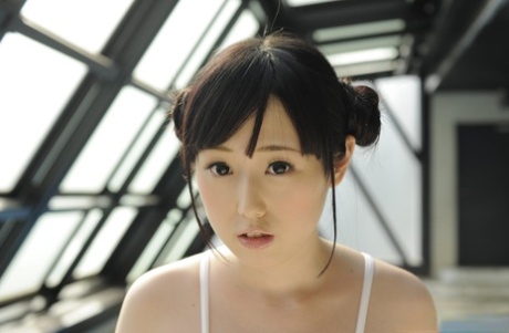 Innocent looking Japanese girl Machiko Ono gets bare naked near an indoor pool
