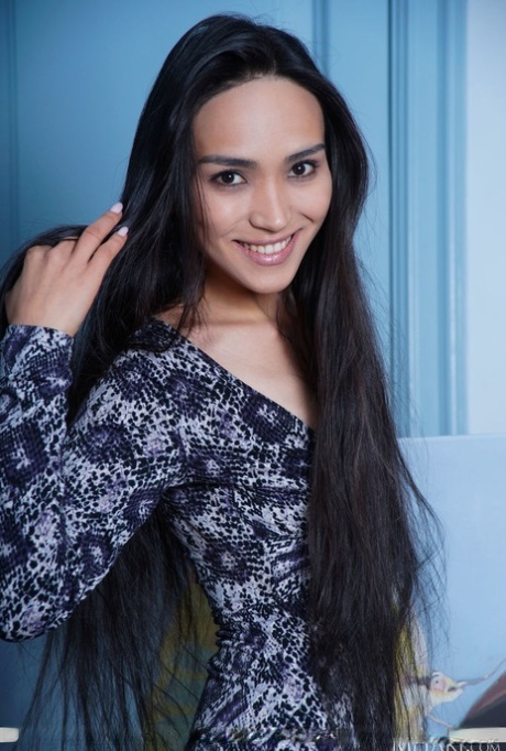 Dark-haired beauty Rezza highlights her bush during a nude modelling session