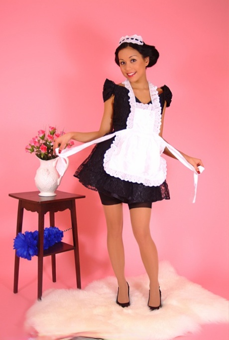 Pinup model Petra Lily So doffs her maid outfit to go topless