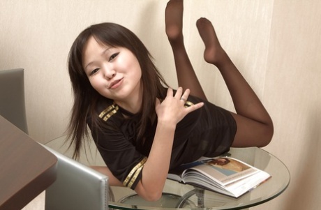 Asian babe Alexa is busy with spreading her chubby vulvar lips