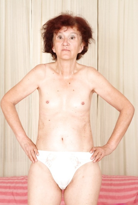 Redhead granny Marcelina shows herself naked in the bedroom!