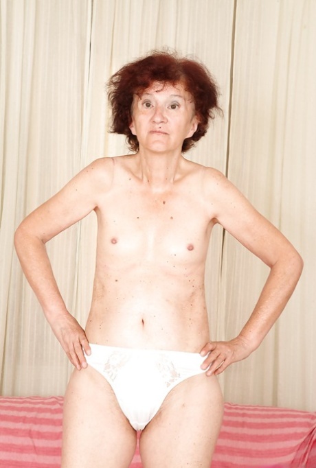 Redhead granny Marcelina shows herself naked in the bedroom!