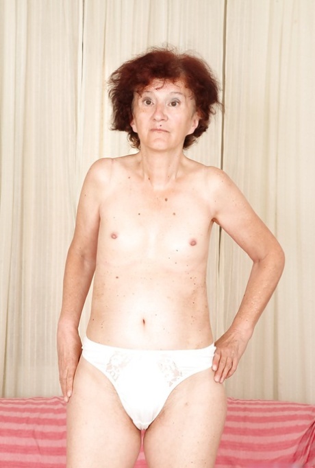 Redhead granny Marcelina shows herself naked in the bedroom!