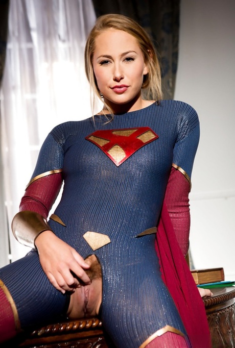 Leggy blonde pornstar Carter Cruise opens crotchless outfit to expose cunt