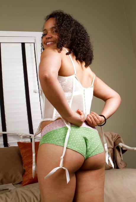 Horny ebony babe Erica stripping and teasing her hairy slit