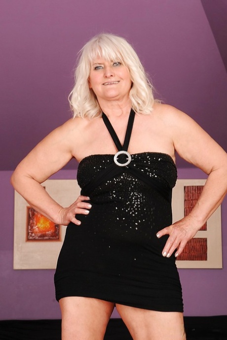 Fatty granny with big flabby jugs stripping and spreading her legs
