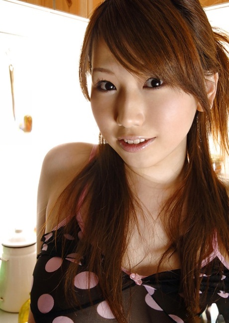 Stunning asian babe with big tits Ai Sayama stripping in the kitchen