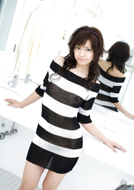 Alluring asian coed on high heels Misaki Mori stripping off her dress