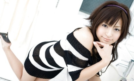 Alluring asian coed on high heels Misaki Mori stripping off her dress