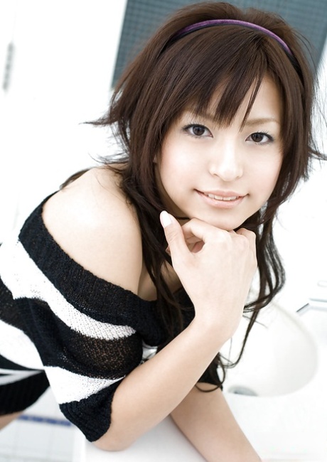 Alluring asian coed on high heels Misaki Mori stripping off her dress