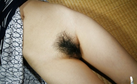 Foxy asian cutie with hairy cunt slipping off her lacy panties