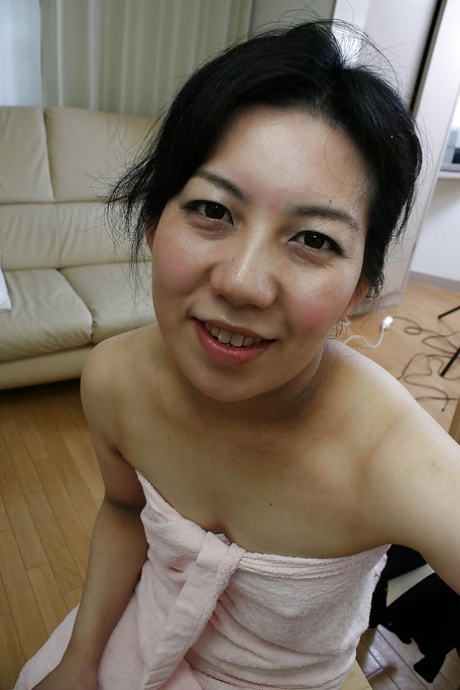 Lusty asian mature lady has some pussy fingering fun after bath