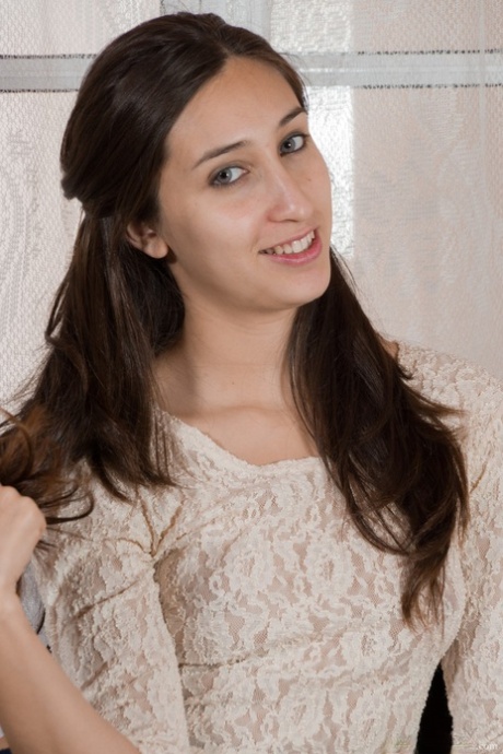 Charming teen Vilma strips in the chair and spreads her legs and hairy vagina