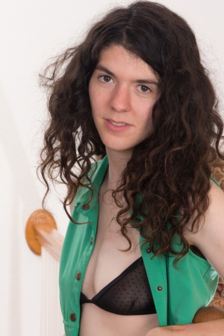 Natural brunette Silki Smith getting naked and revealing her super hairy body