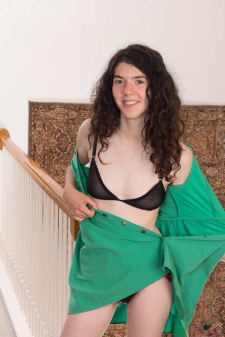 Natural brunette Silki Smith getting naked and revealing her super hairy body