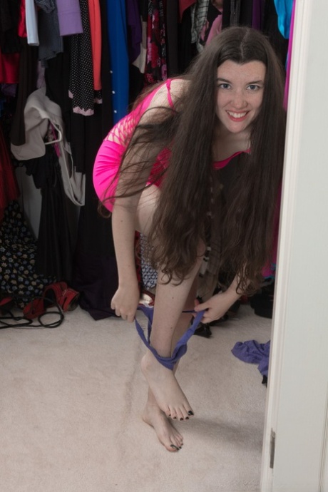 Petite brunette Gabby Smith showing off her hairy twat in the dressing room