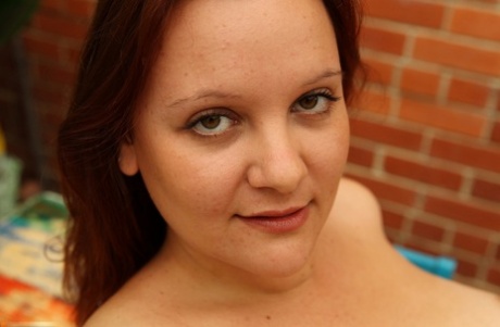 Chubby Australian Virginia peels on the patio showing big tits & hairy bush