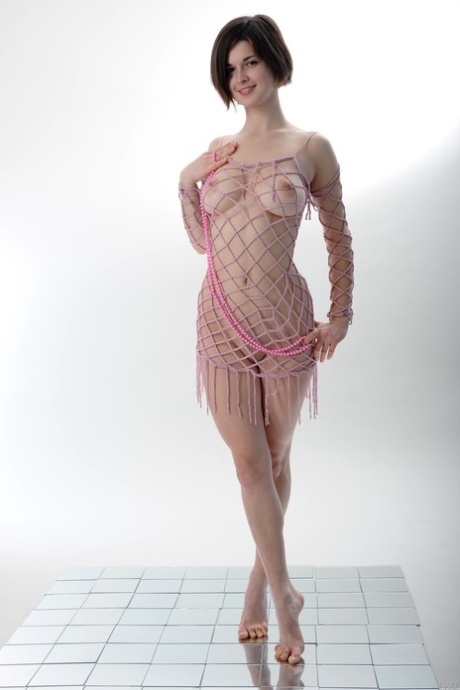 Comely babe Margaret A shows her beautiful breasts & her bald pussy