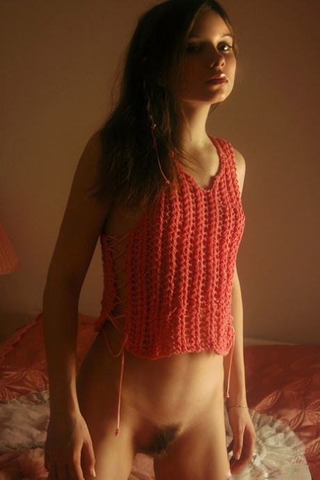 Shy teen babe Anna S displays her long pubic hair and small tits