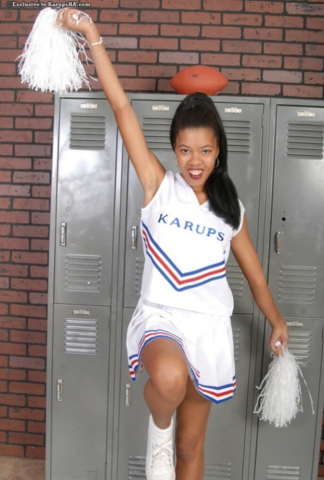 Gorgeous amateur cheerleader Dinah strips her uniform & shows her hairy cunt