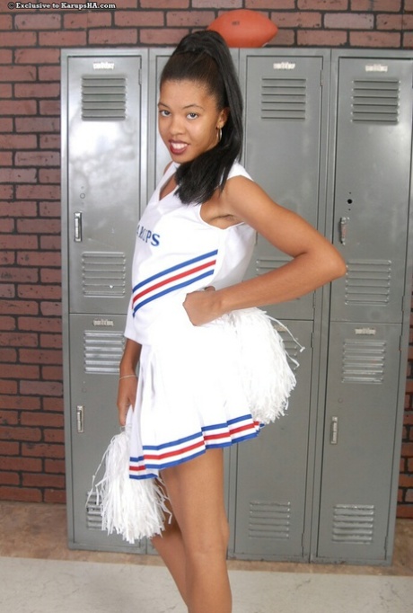 Gorgeous amateur cheerleader Dinah strips her uniform & shows her hairy cunt