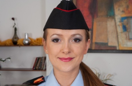 Horny policewoman Violet Moon shows her hot ass and natural tits at home