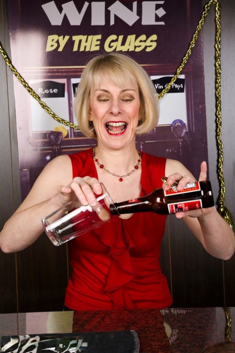 Charming mature bartender Hazel fucking her hairy pussy with a toy at work
