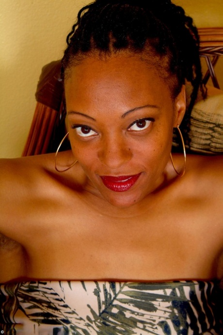 Kinky mature with dreads Pepper exposes her saggy tits and poses naked