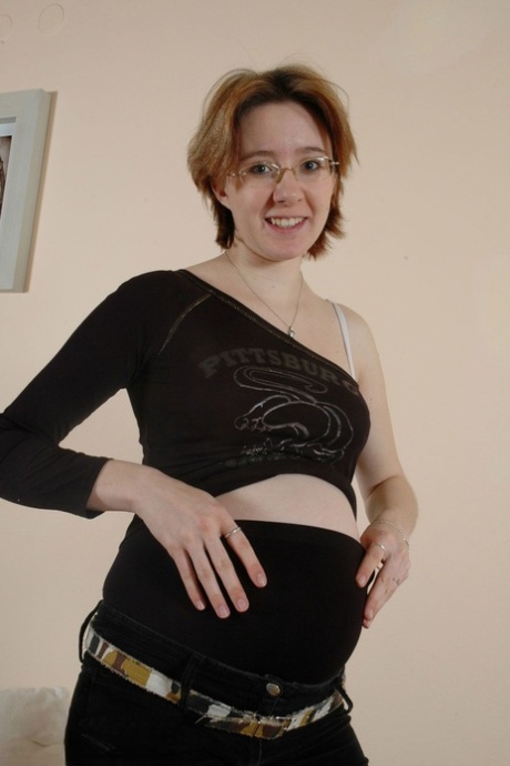 Pregnant amateur woman Kitty plays with her lactating tits and hairy vagina