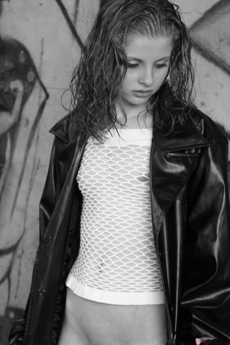 Sexy babe Lil Candy poses bottomless in her sheer top & leather jacket