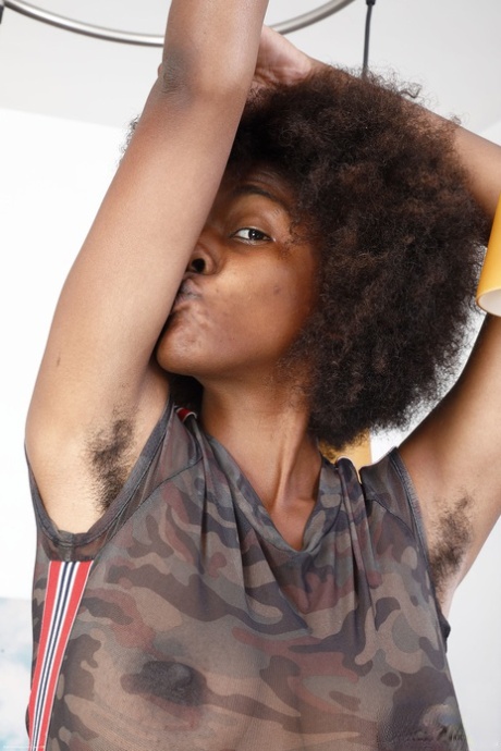 Exotic black babe Panreece showing off her big natural tits and hairy holes