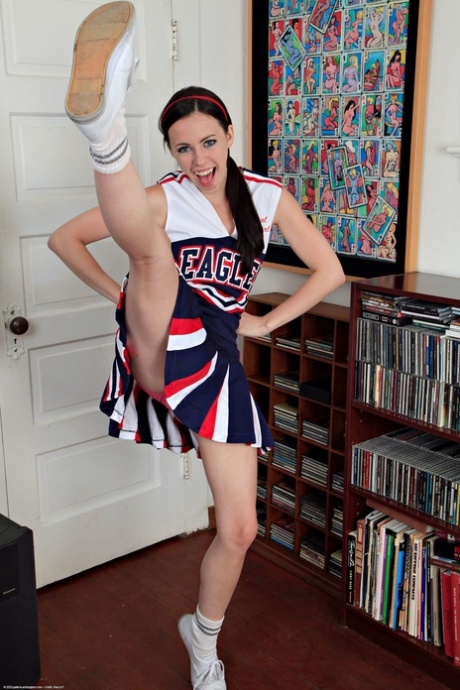 American cheerleader Veronica Radke undresses & slowly rubs her cute pussy