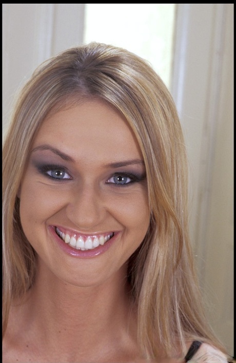 Smiley European Kristyna strips and poses naked by the Christmas tree
