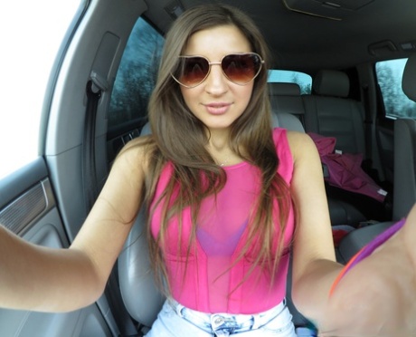 Marvelous amateur babe Melena Tara unveils her big tits & pussy while driving