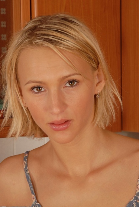 Petite blonde Petty shows her hairy pussy up close in sexy kitchen solo