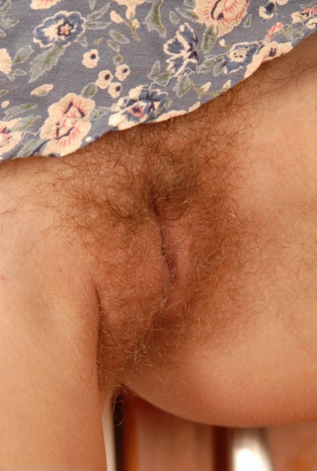 Petite blonde Petty shows her hairy pussy up close in sexy kitchen solo