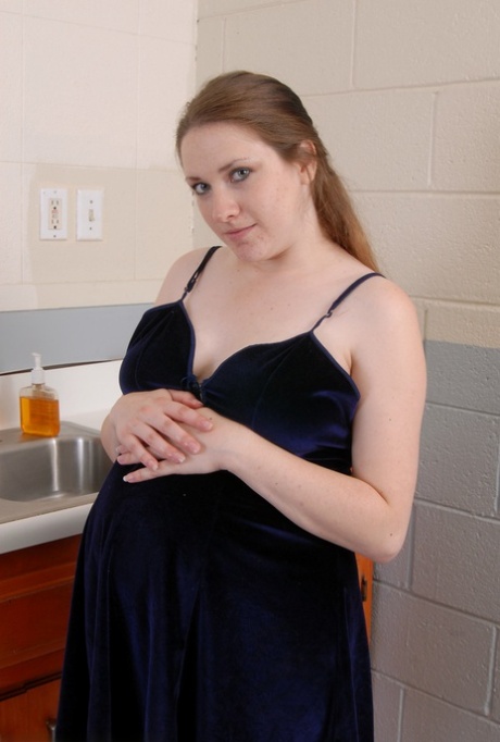Pregnant amateur teen Rose exposes her swollen big tits and spreads her holes