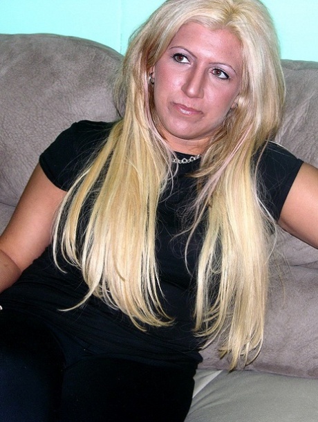 Mature blonde Monique shows her shaved pussy while completely naked