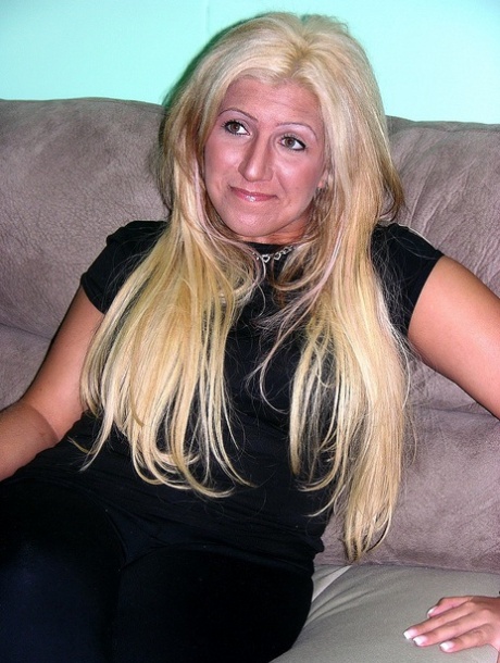 Mature blonde Monique shows her shaved pussy while completely naked
