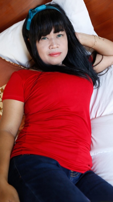 Chubby Asian babe Suraya strips naked before a hardcore POV sex session
