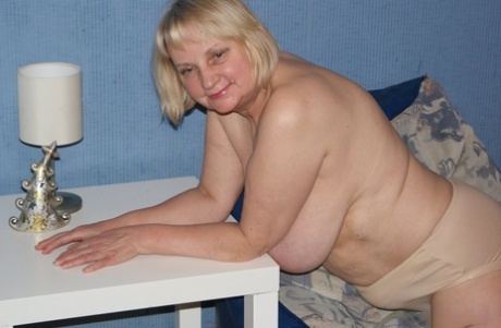 Chubby old granny Helga exposes her big tits and poses in lacy stockings